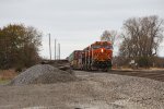 BNSF 7454 East waits for the signal block ahead to clear before proceeding again